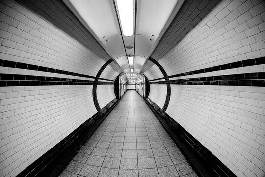 Tunnel Super Wide Angle of Tunnel Symmetrical Walkway with tiles on the ceiling and floor and walls