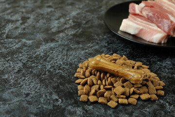 Concept of natural pet food on black smokey background