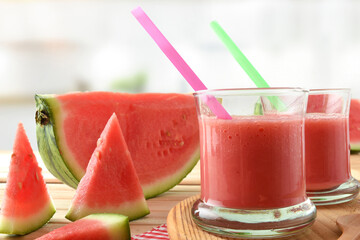 Two glasses with watermelon juice and fruit in kitchen detail