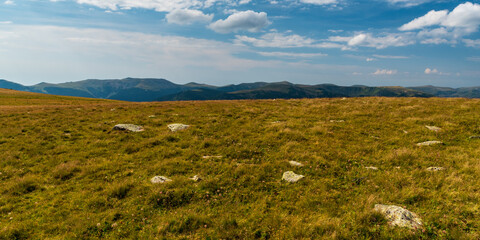 La Pir mountain pass above Zanoaga lake in Retezat mountains with Godeanu mountain range on the background in Romania