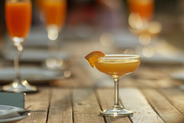 glass of  orange juice on wooden table