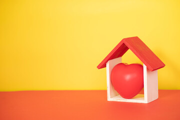 Layout depicting the proverb Home is where the heart is. Selective focus points. Blurred background