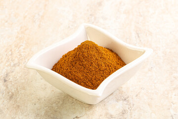 Dry Paprika powder in the bowl