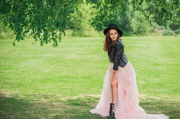 Tender elegant young bride in pink pastel wedding dress, fashionable fancy collection