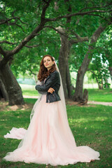 Obraz na płótnie Canvas Tender elegant young bride in pink pastel wedding dress, fashionable fancy collection