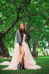 Fototapeta premium Tender elegant young bride in pink pastel wedding dress, fashionable fancy collection