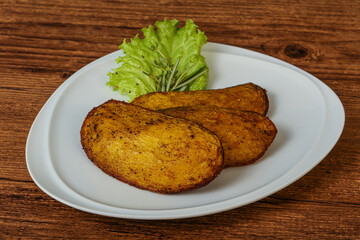 Baked potato with herbs and spices