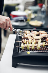Preparing barbeque on a electrical modern grill outdoors.