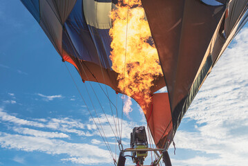 Hot air balloon with flame. Closeup.hot air balloon as it takes you on an adventure over the earth.