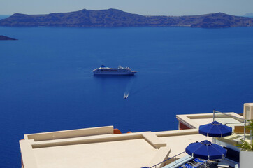 Amazing view over Oia town with blue domes, roofs and churches in amazing travel and honeymoon...