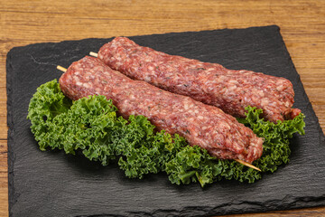 Raw minced beef kebab skewer