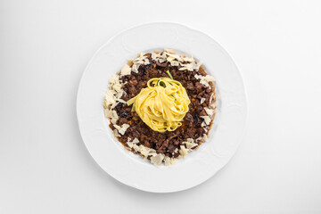 Delicious beef stroganoff with pasta on white plate isolated on white background