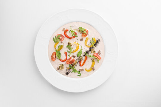 Vitello tonnato traditional italian dish on white plate isolated on white background