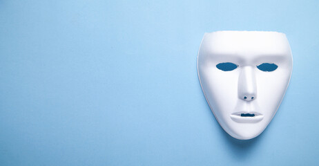 White mask on the blue background.