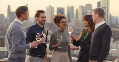 Group of business people toasting with wine after work