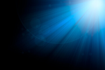 blue rays light and bokeh on black background for overlay design