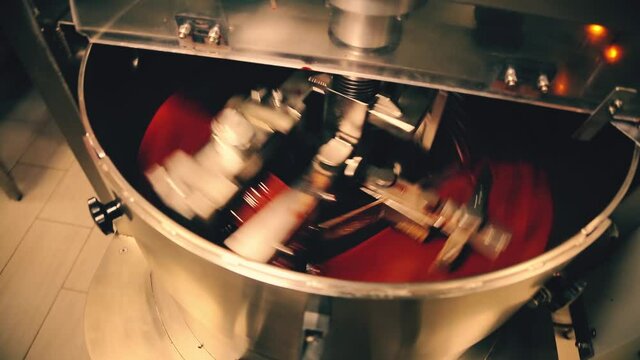 Chocolate factory. Close-up of stirring hot chocolate. Industrial mixer for making chocolate at work