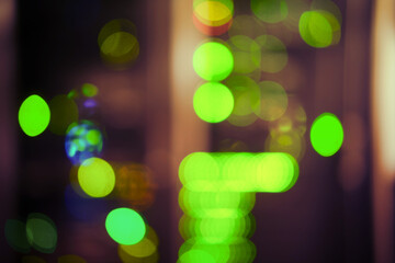 Bokeh of green lamps of computer equipment in the server room, blurred abstract background