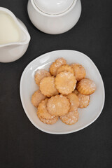 Homemade shortbread cookies on white plate, top view. Baking for tea