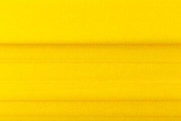 Bright yellow abstract background with horizontal lines and copy space. Trendy textured colored background. Concept of modern template for website or advertising banner 