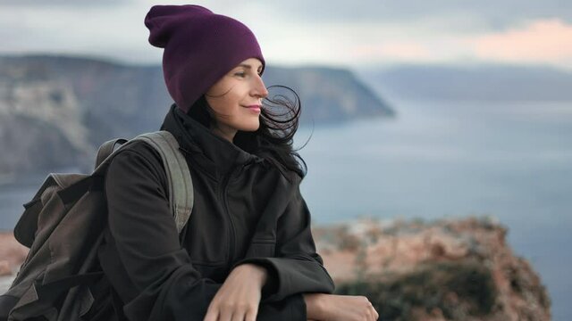Pleasant traveler hipster woman contemplating ea scenery mountain peak freedom inspiration 