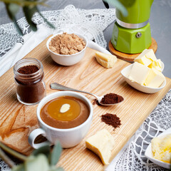 Bulletproof coffee, blended with organic butter and MCT coconut oil, paleo, keto, ketogenic drink breakfast.