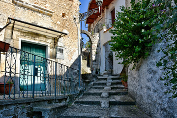 Fototapeta na wymiar A small street between the old houses of Sant'Angelo d'Alife, a mountain village in the province of Caserta.