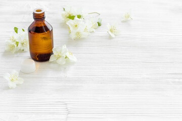Obraz na płótnie Canvas Essential aroma jasmine flowers oil for perfume or massage