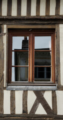 Beautiful window with traditionally painted wall, Honfleur, France