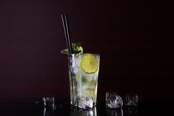 Cocktail on black background. Cocktail at the bar. Alcoholic drink at the night club.