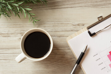 Coffee and documents on the desk.　デスクの上のコーヒーと資料