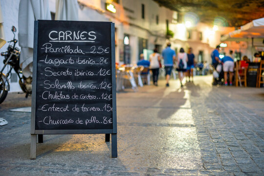 Menu of the meats of restaurant in the sidewalk in Spain