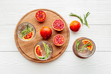 Citrus juice and slices of grapefruit and red oranges. Overhead view