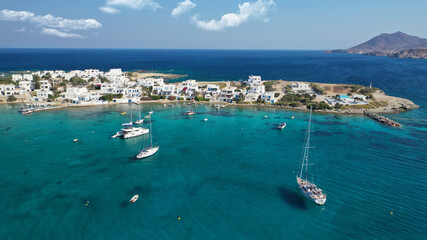 Fototapeta na wymiar Aerial drone photo of picturesque fishing village of Polonia or Pollonia with traditional fishing boats anchored next to island of Kimolos, Milos island, Cyclades, Greece