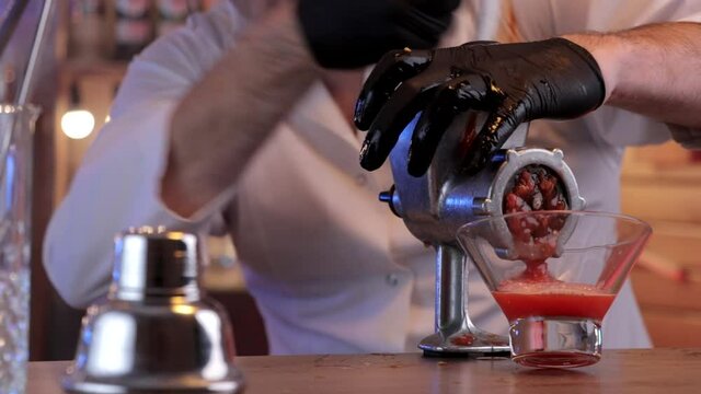 bartender making  fresh tomato juice