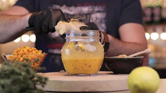 a  man clean ginger peel