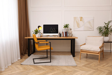 Room interior with comfortable workplace. Modern computer on wooden desk