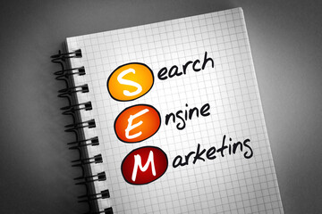 SEM - Search Engine Marketing acronym on notepad, business concept background