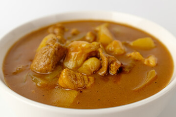 Curry with spices on a white background