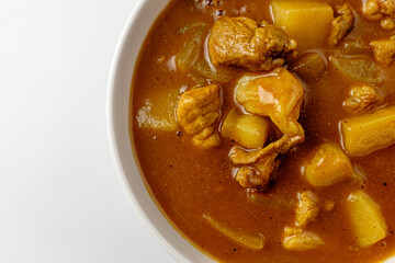 Curry with spices on a white background