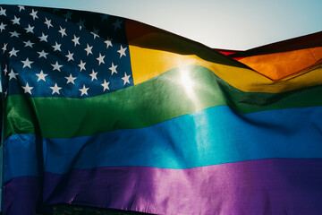 a rainbow US flag is waving on the sky