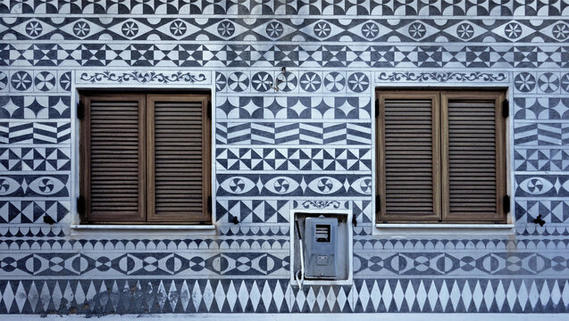 old window with shutters and ornately painted wall, Pirgi, Chios, Greek islands, Greece