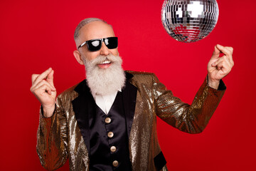 Photo of aged man happy positive smile have fun dance party club event isolated over red color...