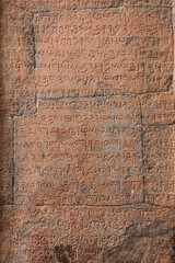Ancient inscriptions stone wall in ancient Tamil language