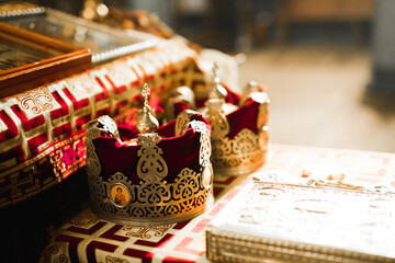 Golden crowns lying on the table in church