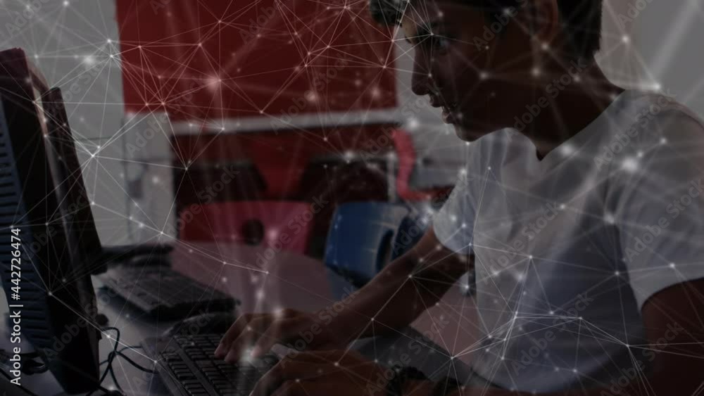 Poster animation of network of connections moving over schoolboy using computer in class