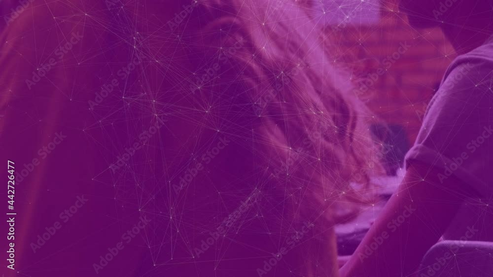 Poster animation of network of connections moving over schoolchildren using computers in class