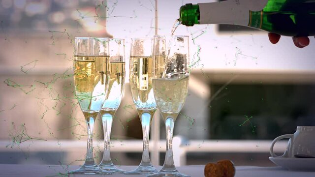 Animation of bottle being poured into four glasses of champagne