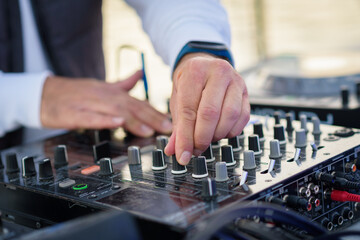 DJ in the mix, closeup on the hands