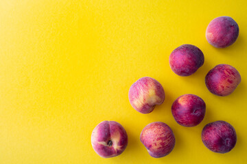 ripe peaches on a yellow background